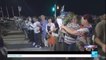 Attack in Nice: residents form human chain to move flowers and momentos along promenade