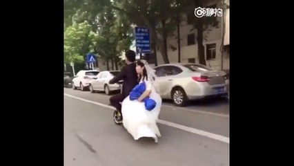 Fail- Bride falls hard off of the back of groom's scooter
