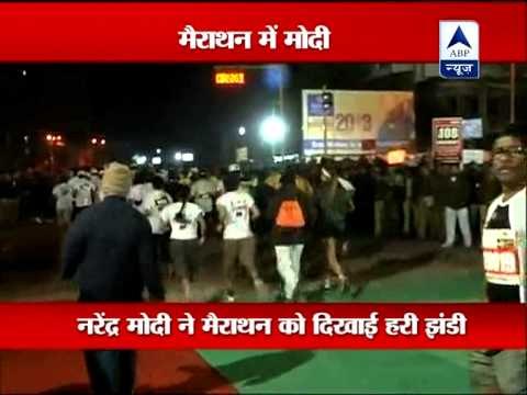 Gujarat CM Narendra Modi flags off Sabarmati Marathon 2013