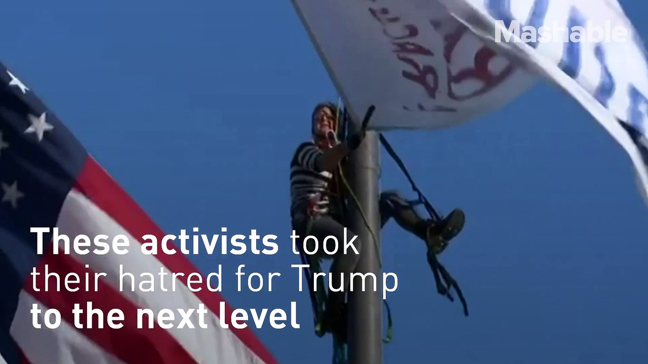 Anti Trump Activists Scale 60 ( Foot Flag Poles Outside Cleveland's Rock and Roll Hall of Fame )