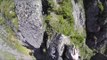 Mountain Runner Free Climbs Narrow Rocky Outcrop