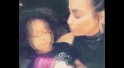 Gimme kiss! Kim Kardashian as the pair play with her Minnie Mouse doll