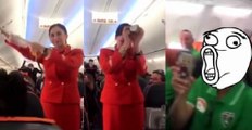 Football Fans Hilariously Distract Flight Attendant Who Can Barely Get Through Her Job