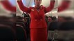 Football fans on flight distracting the air hostess doing the safety announcement