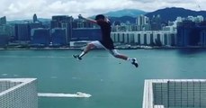 Brave boy Jumping through Roofs of building in Hong Kong