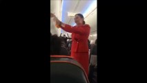 Football fans on flight distracting the air hostess