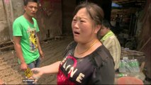 China floods: Public anger grows as waters recede