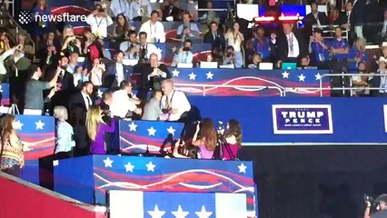 Protestor holds up anti-Trump banner during nomination speech