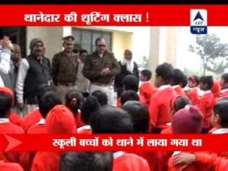 Cop flaunts his gun among students