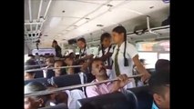 School Girls standing all Men's sitting in Srilanka Bus