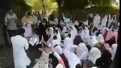 A protesting procecession of nurses, chanting against PM & CM