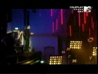 Chris Martin Jumping dangerously (hugs Noel Gallagher