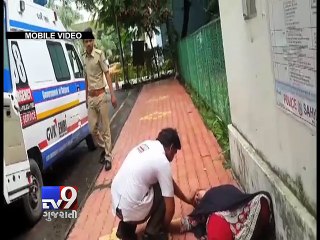 Download Video: Woman attempts suicide outside police commissioner office, Surat - Tv9 Gujarati