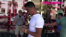 Cristiano Ronaldo push away a fan which wanted to take a photo with him