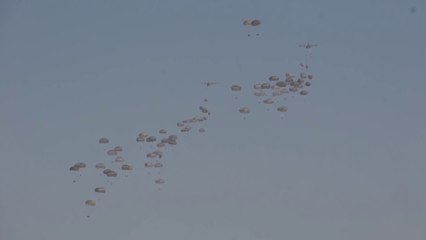 Massive US Soldiers Paradrop Over White Desert