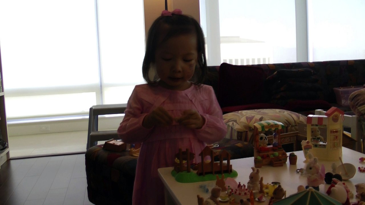 Girl Playing Sylvanian Families Sandbox