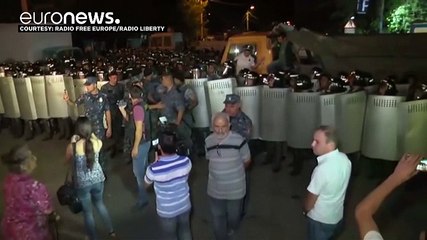 Dozens wounded in further night of clashes at besieged Yerevan police station