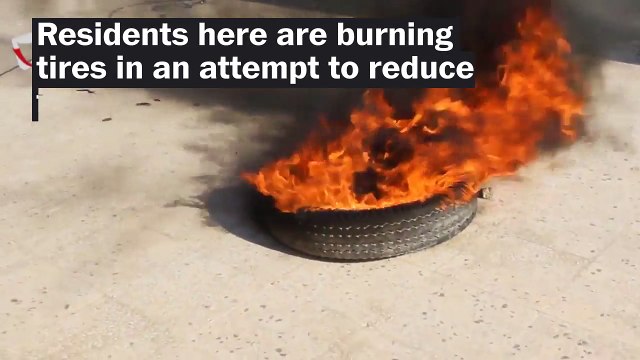 Aleppo residents burn tires to create smoke screen against bombings