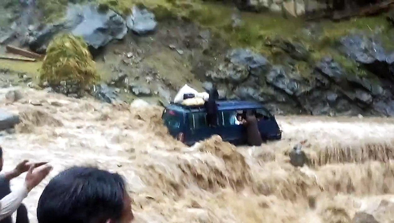 Mini Bus Gets Stuck Crossing The River