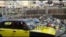 أكوام القمامة تشل حركة المرور  بشارع ملك حفني