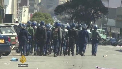 Zimbabwe police violently break up anti-Mugabe protests