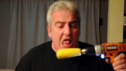Man Eats Corn on the Cob from a Drill