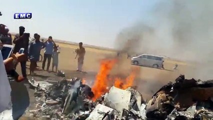 Helicopter delivering AID  is seen dropping 'chemical weapons' on a Syrian...