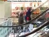 Funny videos , one of the villagers walking up the stairs in a shopping center