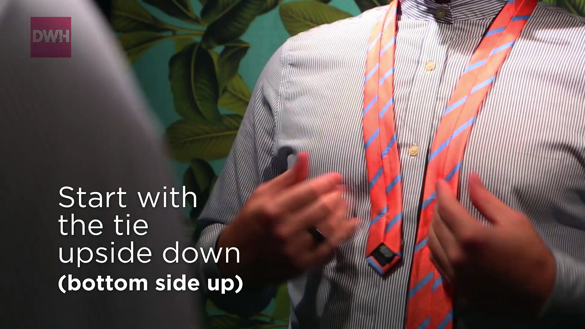 Wrists tie necktie to a how with Handcuff Knot