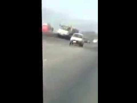 Brave car driver controls and stops 22 wheeler trailer with failed brakes on motorway in pakistan