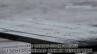 Clear raindrops falling down on wooden table. Sad and rainy weather, bad mood. Stock Footage