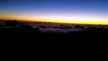 Eerie luminous clouds at dawn above a rainforest in Maui.