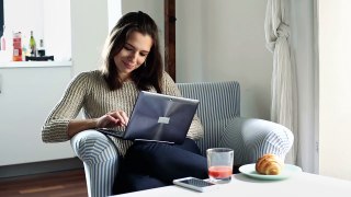 woman sit in armchair and typing on modern laptop at home ejygg5vxg  D