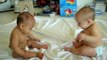 Twin baby boys have a conversation