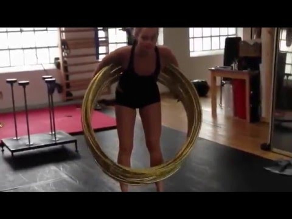 Hula Hooper Spins Around Multiple Hoops