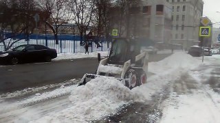 Small tractor remove snow in Moscow today