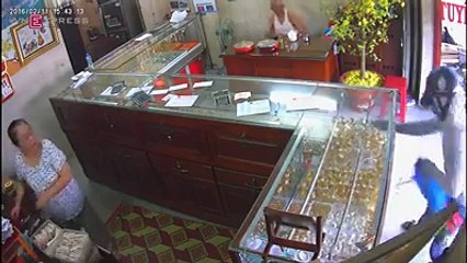 Smashing a jewelry store with a hammer. Let's see how much he could steal!