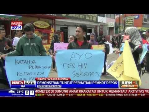 Warga dan Mahasiswa Berdemo Jelang Hari AIDS Sedunia