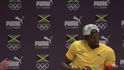Usain Bolt sambas off the stage after journalist serenades him