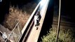 CCTV captures park bench pushed over bridge onto railway tracks