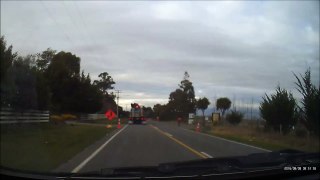 Truck knocking over temporary road signs on Cones Rd, Rangiora