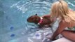 Capybara Dons a Flower Necklake and Takes a Dip in a Swimming Pool