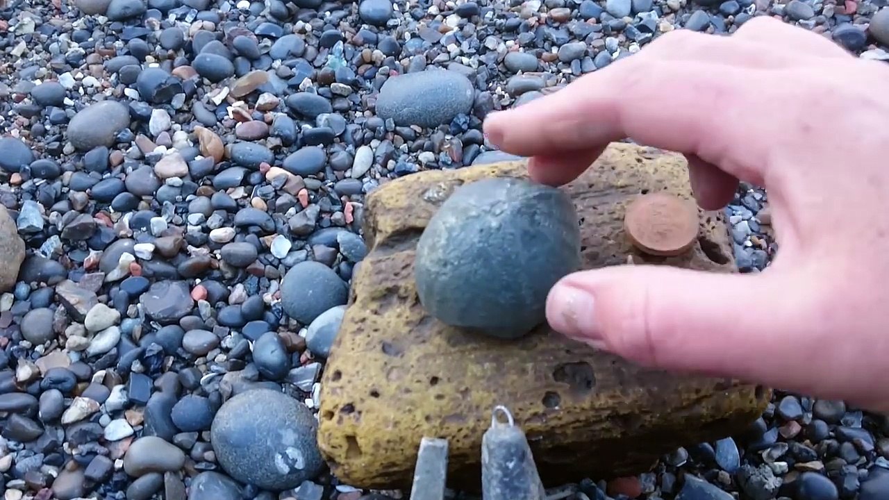 Mudlarking along the Thames foreshore. A spooky doll face and a rude coin!