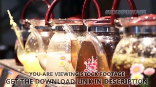 Rack focus shot of decorative glass teapots, variety of herbal tea at festival. Stock Footage