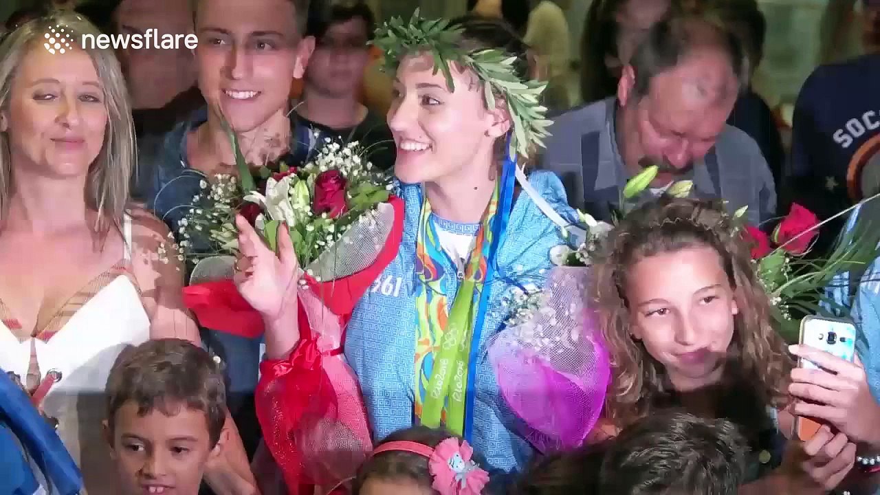 Greek Olympic medallist Anna Korakaki arrives back home to hoards of fans