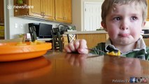 Little boy really doesn't want to eat his vegetables