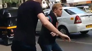 English boys are trying to cross the road in Pakistan