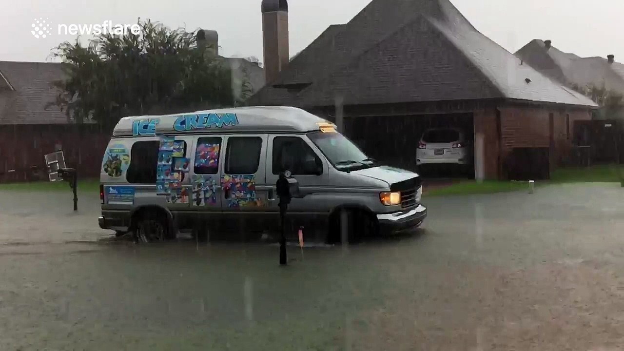 Ice cream truck driving through historic flood waters in Louisiana
