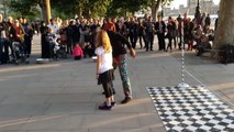 Tourist girl is challenged by street performers in central London