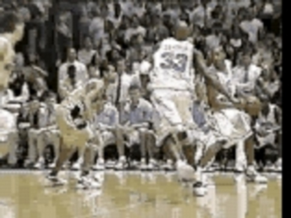NBA - Vince Carter in North Carolina Dunks Over Tim Duncan